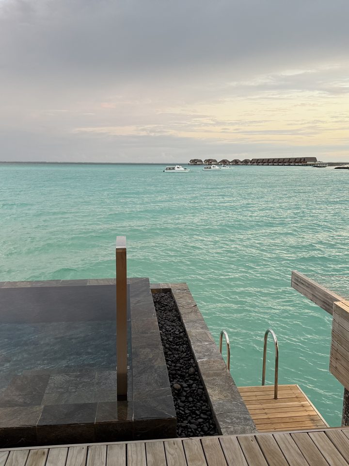 The Overwater Pool Villa pool at sunset, from our own footage