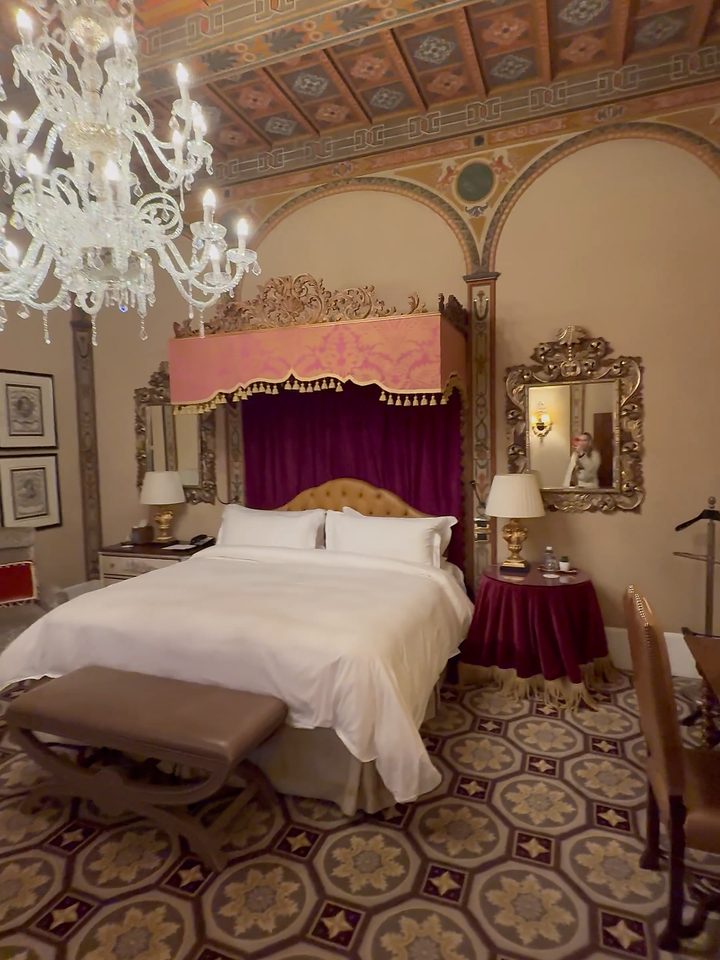The bed under the frescoed ceiling, from our own footage
