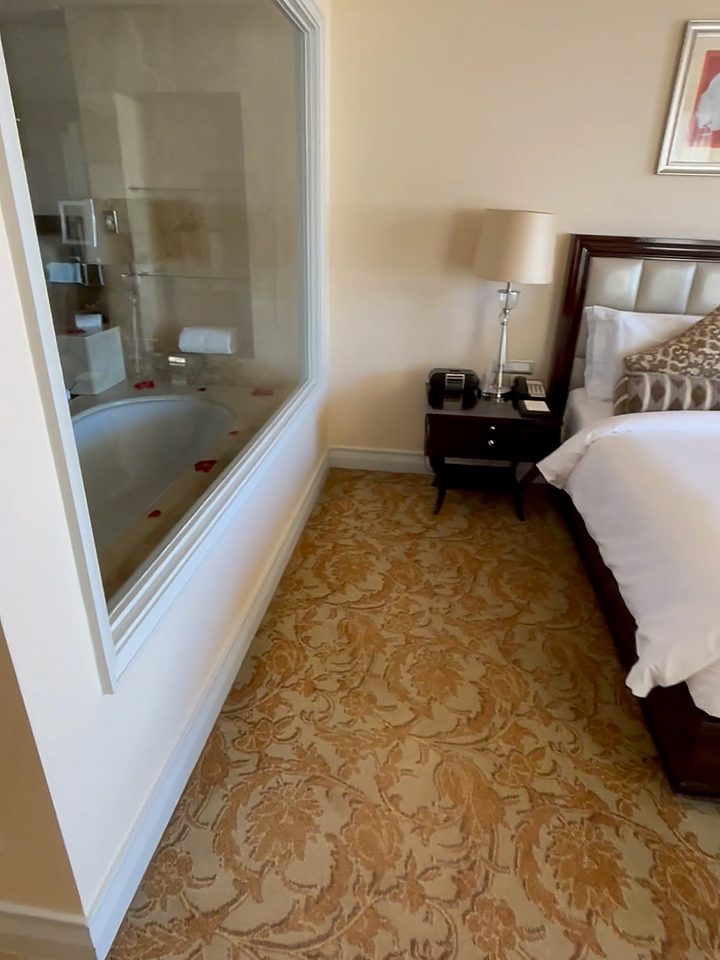 The glass wall between bedroom and bathroom, from our own footage